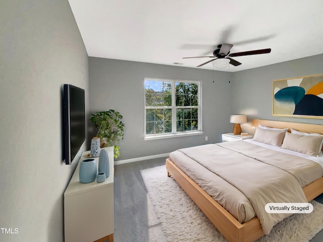 bedroom featuring ceiling fan and carpet