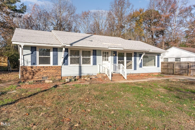 ranch-style house with a front lawn