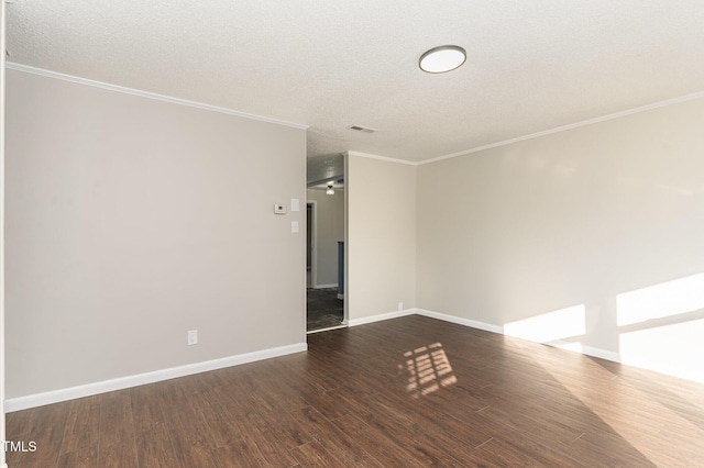 empty room featuring a textured ceiling, crown molding, ceiling fan, and dark hardwood / wood-style floors