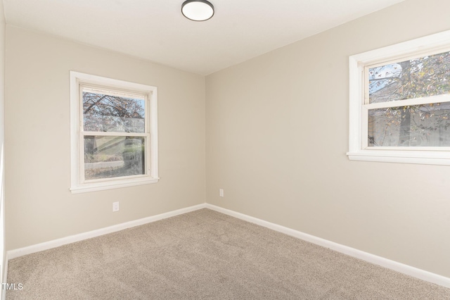 unfurnished room featuring carpet floors