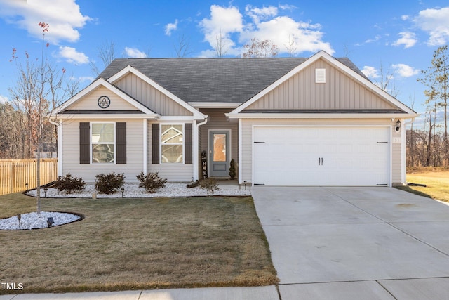 view of front of house featuring a garage and a front yard