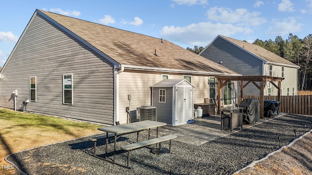 rear view of house featuring a patio area, a pergola, and central air condition unit