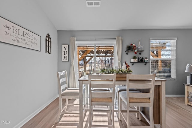 dining area with light hardwood / wood-style flooring