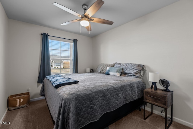 bedroom featuring dark colored carpet and ceiling fan