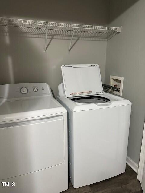 clothes washing area with independent washer and dryer