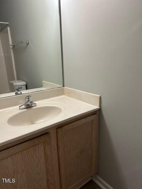 bathroom with vanity and toilet