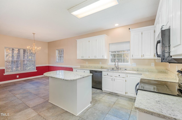 kitchen with sink, black appliances, a kitchen island, pendant lighting, and white cabinets