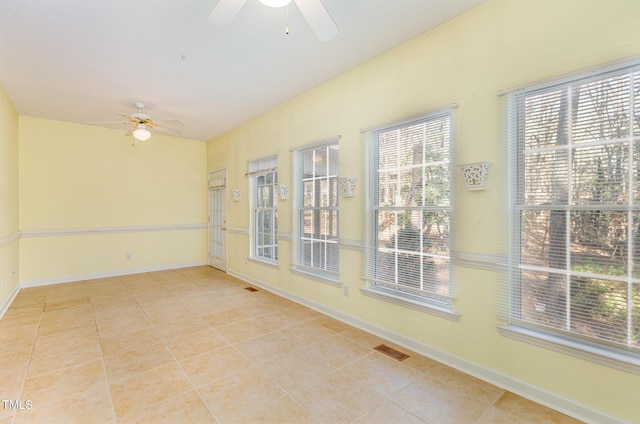 interior space with ceiling fan