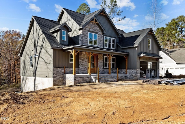 craftsman-style home with a porch and a garage