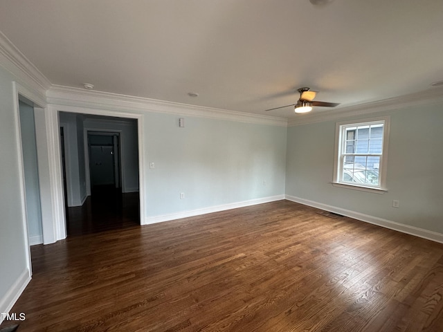 empty room featuring crown molding, dark hardwood / wood-style floors, and ceiling fan