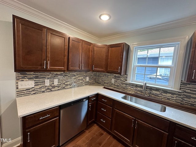 kitchen with sink, ornamental molding, and dishwasher