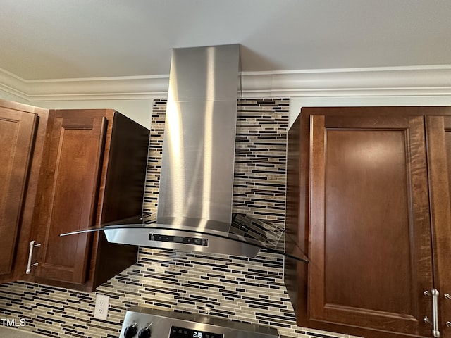 interior details featuring crown molding and decorative backsplash