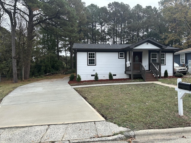 view of front of home with a porch and a front yard