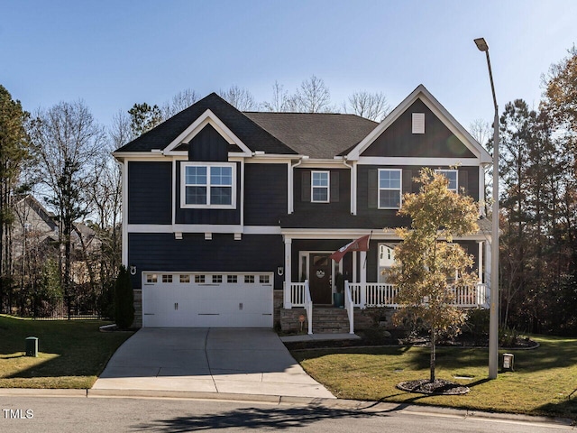 craftsman-style house with a front yard, a porch, and a garage