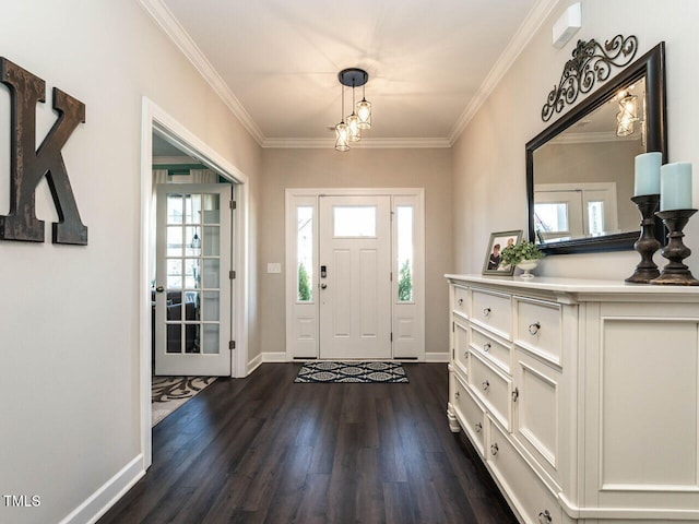 foyer entrance with plenty of natural light, ornamental molding, and dark wood-type flooring