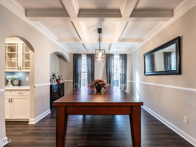 unfurnished dining area featuring coffered ceiling, wine cooler, dark hardwood / wood-style floors, ornamental molding, and beam ceiling