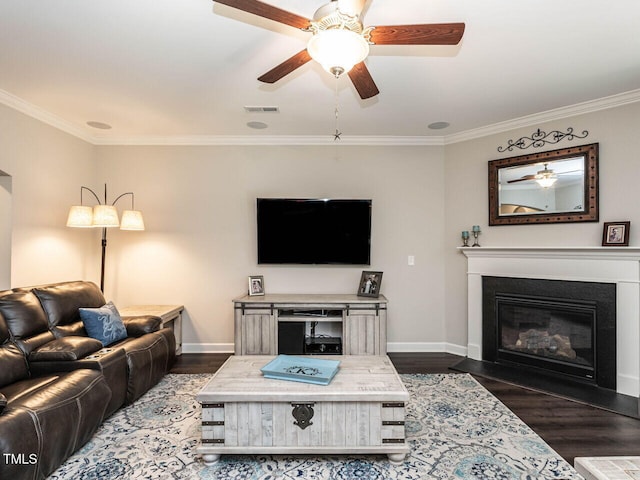 living room featuring dark hardwood / wood-style floors and crown molding