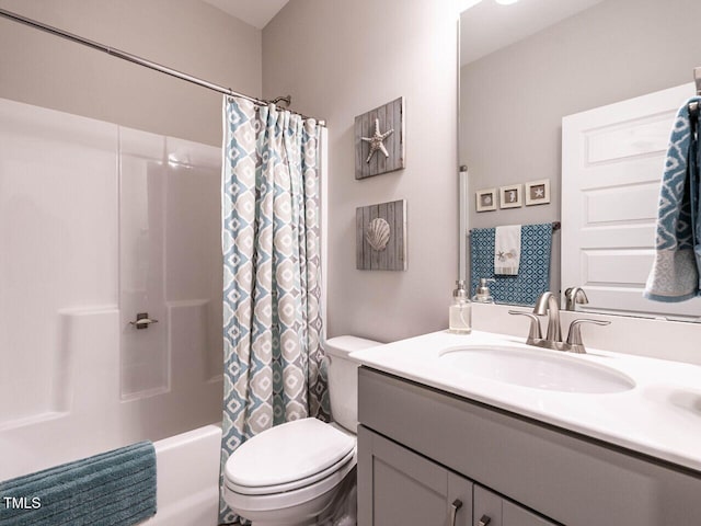 full bathroom with vanity, shower / bathtub combination with curtain, and toilet