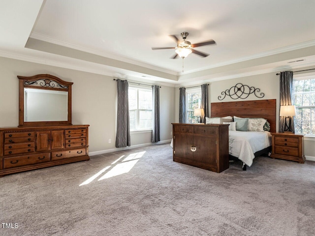 bedroom with light carpet, a raised ceiling, ceiling fan, and crown molding