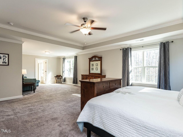 bedroom with multiple windows, ceiling fan, crown molding, and carpet floors