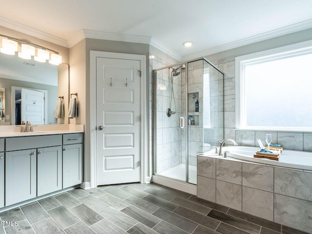 bathroom featuring vanity, independent shower and bath, and ornamental molding