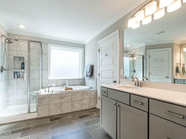 bathroom with vanity, ornamental molding, and plus walk in shower