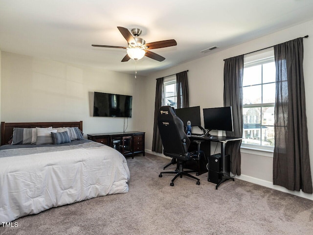 carpeted bedroom featuring ceiling fan