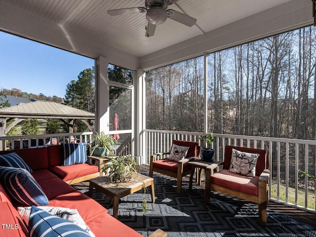 sunroom / solarium with ceiling fan