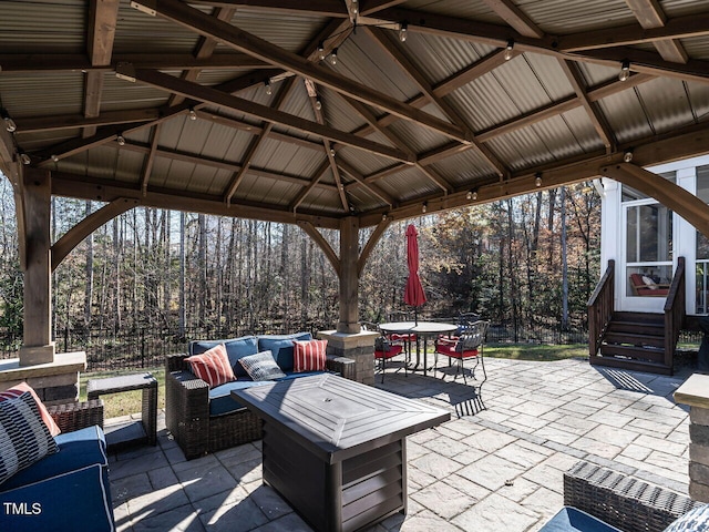 view of patio featuring outdoor lounge area and a gazebo