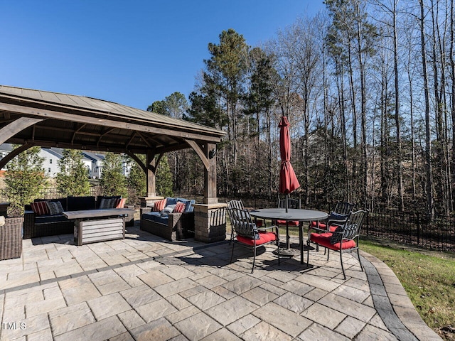 view of patio featuring outdoor lounge area and a gazebo