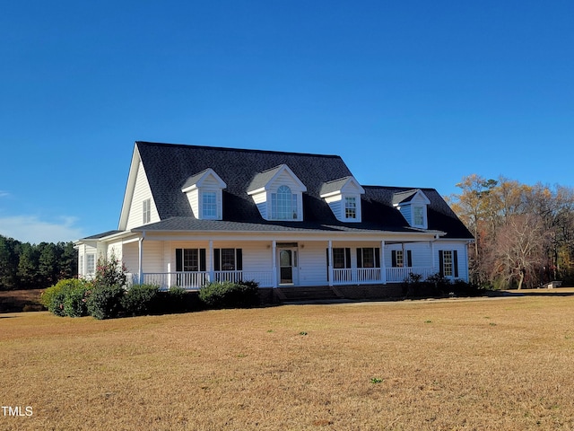 view of front of house with a front yard and a porch