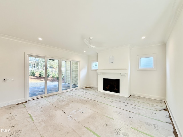 unfurnished living room featuring crown molding and ceiling fan