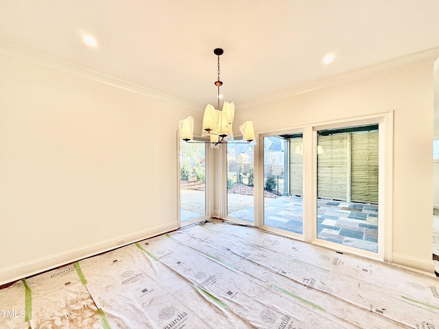 interior space featuring a notable chandelier and ornamental molding