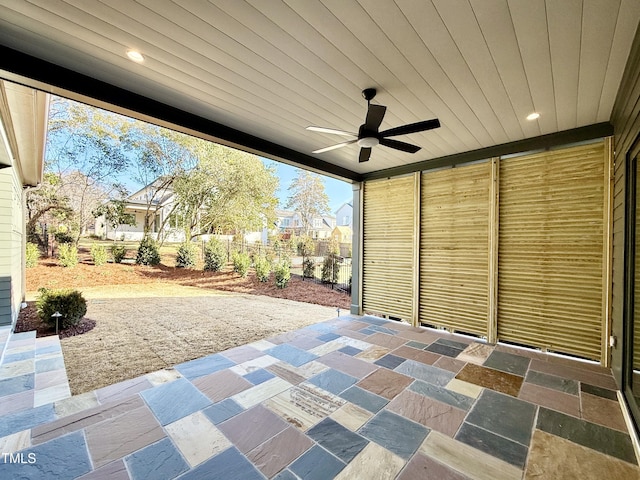 view of patio featuring ceiling fan