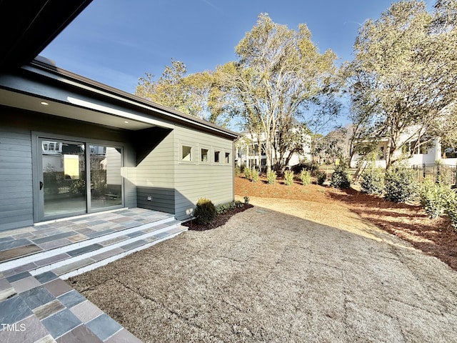 view of property exterior featuring a patio area