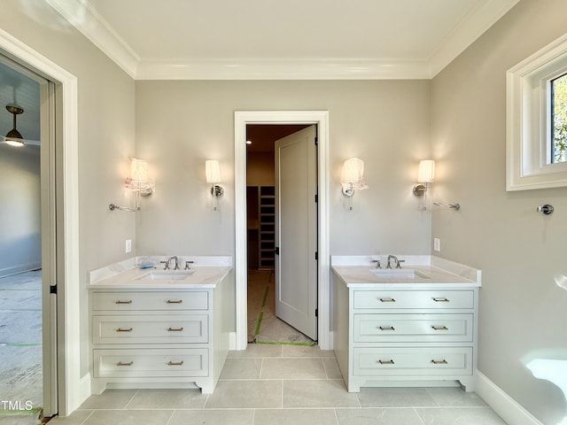 bathroom with tile patterned flooring, vanity, and crown molding