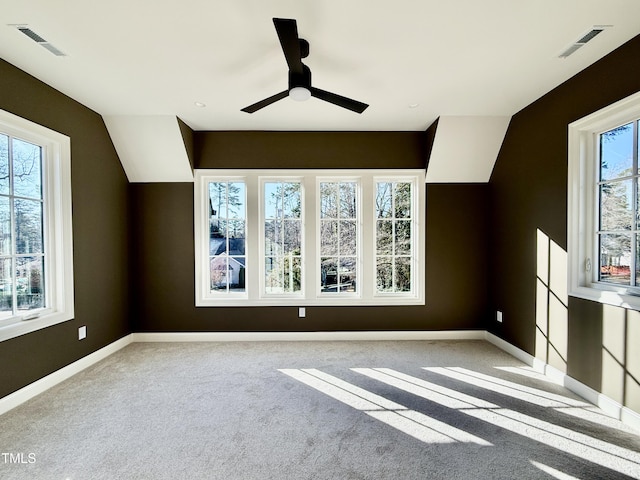 additional living space with light carpet, vaulted ceiling, and ceiling fan