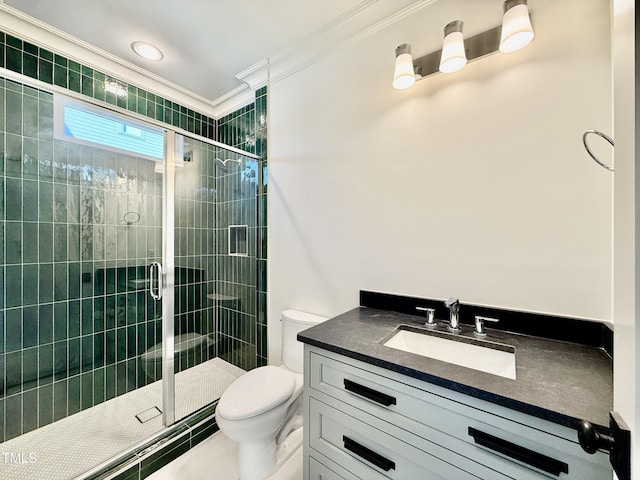 bathroom featuring vanity, crown molding, toilet, and walk in shower