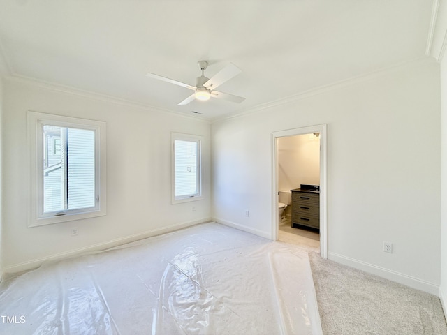 unfurnished bedroom with light carpet, ceiling fan, connected bathroom, and ornamental molding