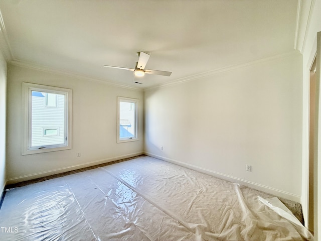 spare room with ceiling fan and ornamental molding