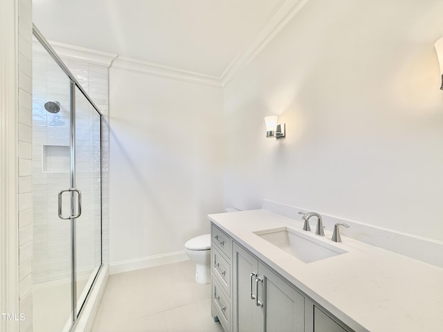 bathroom with vanity, crown molding, toilet, and walk in shower