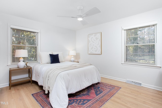 bedroom featuring hardwood / wood-style floors and ceiling fan