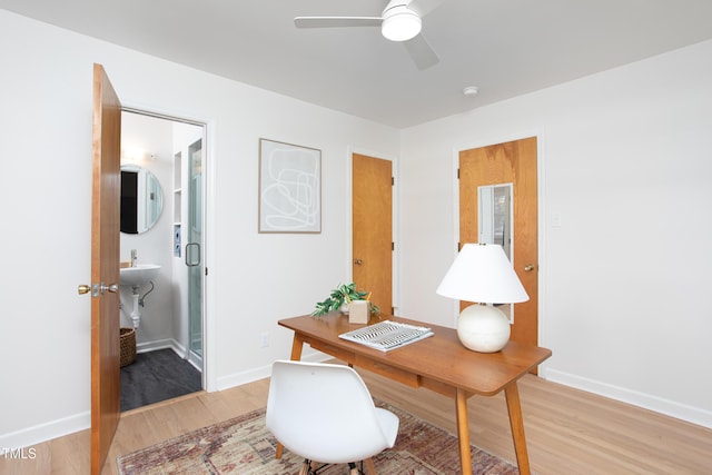 office space featuring ceiling fan and hardwood / wood-style flooring