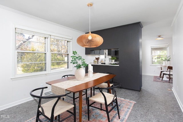 dining area featuring ornamental molding