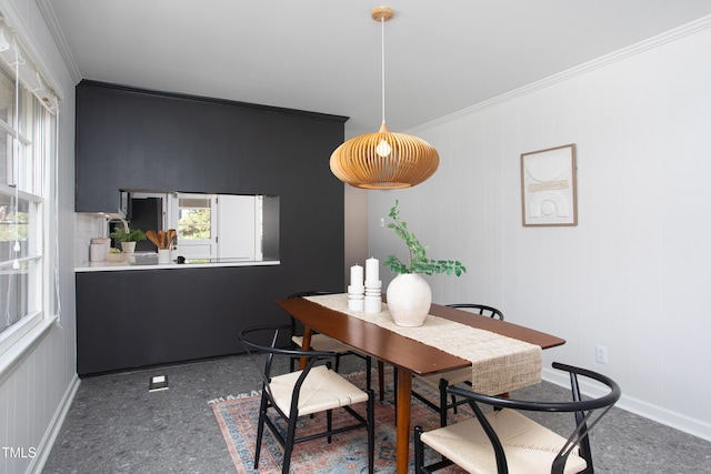 dining space featuring ornamental molding