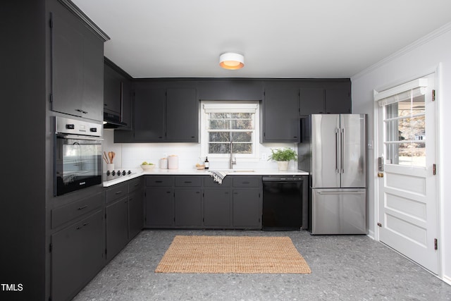 kitchen with tasteful backsplash, crown molding, sink, and appliances with stainless steel finishes