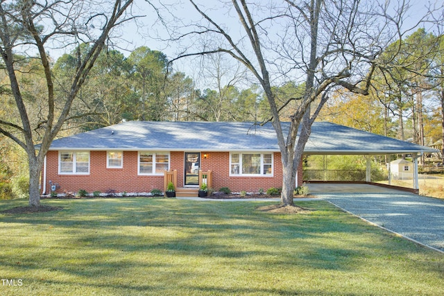 single story home featuring a carport and a front lawn