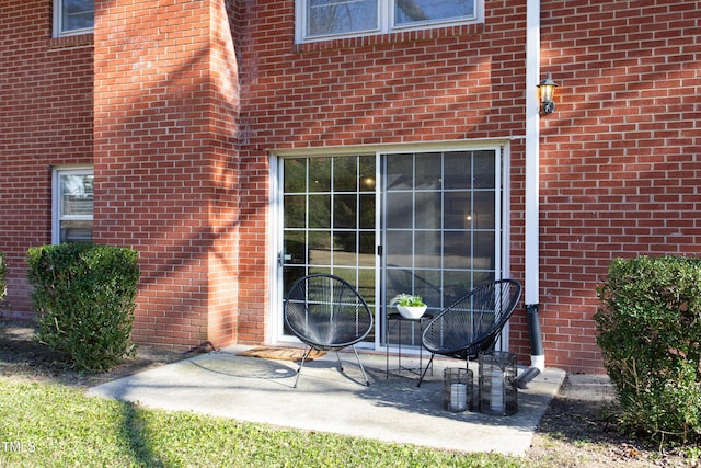 entrance to property with a patio