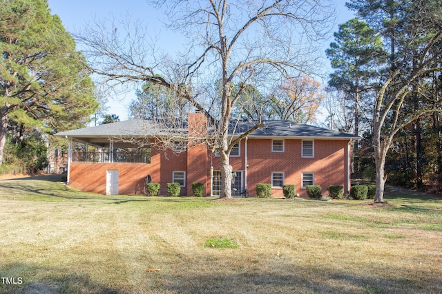 back of house featuring a yard