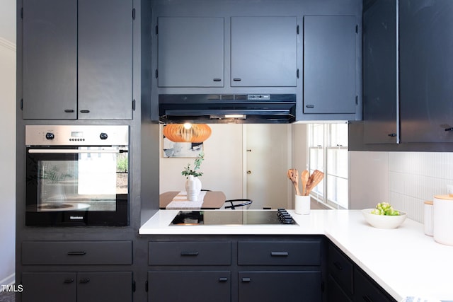 kitchen featuring backsplash, black gas cooktop, oven, and range hood